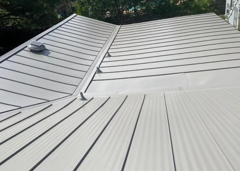Solar attic fan installed on a metal roof for Roof Ventilation in Montgomery